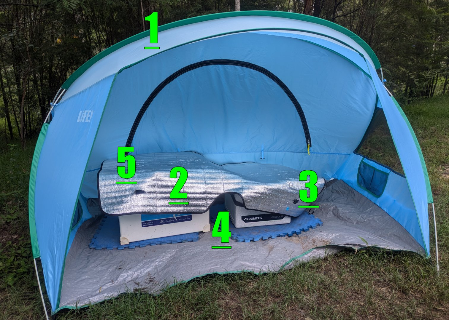 Ice box set up correctly — in shade, wrapped, insulated from ground