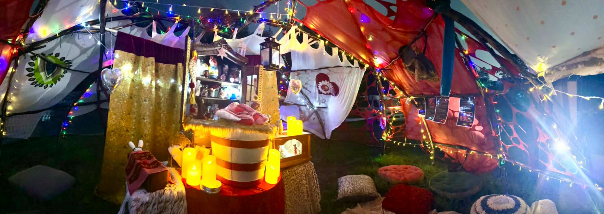 Altar of Passion — wide panoramic interior view with candles, flags and gold curtain