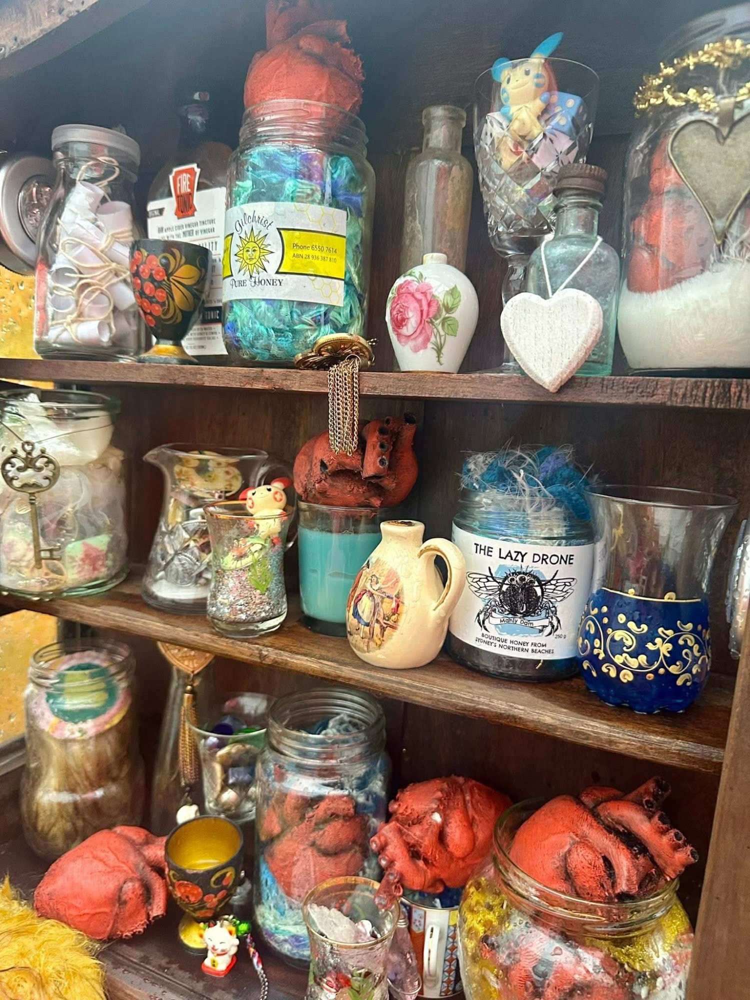 Altar of Passion — cabinet of curiosities, jars, honey, anatomical hearts