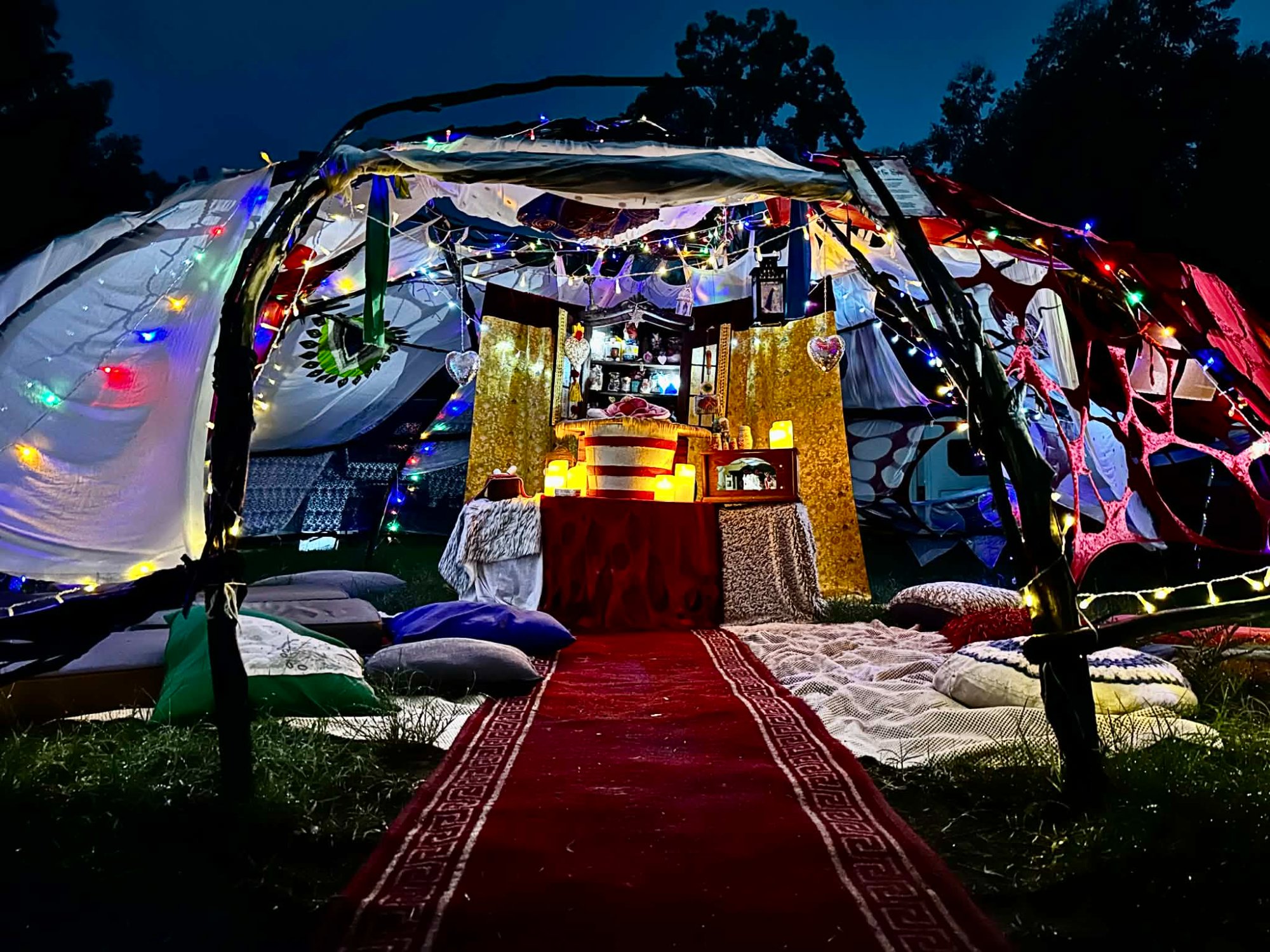 Altar of Passion — inside looking in, red carpet, cushions and glowing altar