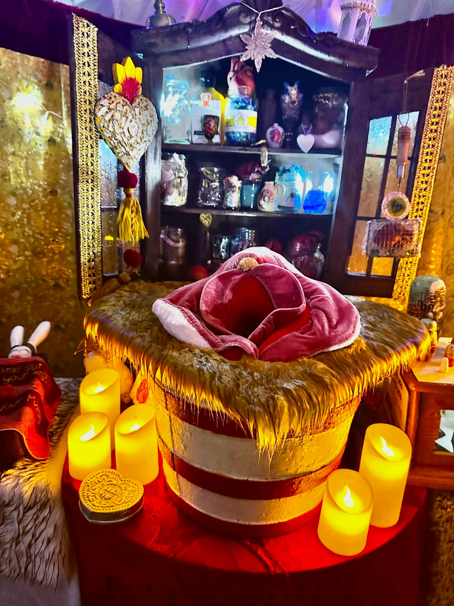 Altar of Passion — central altar with candles, velvet form and glowing cabinet